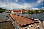 View on the spring Prague gothic Castle and big tugboat, Czech Republic