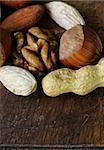 Mix nuts on a wooden background macro shot