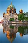 Image of the Berlin Cathedral with reflection in Spree River.