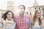 Three young tourists, Plaza de la Virgen, Valencia, Spain