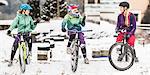 Three female mountain bikers on bikes and chatting