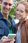 Young couple looking at smartphone