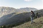 Mid adult woman backpacking in Achensee, Tyrol, Austria