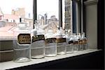 Row of old Apothecary bottles on the windowsill.