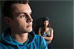 Teenage Girl and Young Man Arguing, Studio Shot