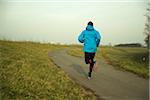 Back View of Mature Man Running Outdors, Mannheim, Baden-Wurttemberg, Germany