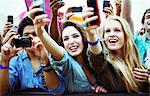 Fans with cameras and camera phones at music festival