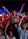 Fans cheering at music festival