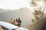 Family looking at mountain view outside car