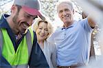 Roadside mechanic helping senior couple