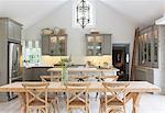 Wooden dining table in luxury kitchen
