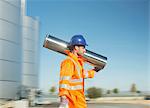 Worker carrying stainless steel tube