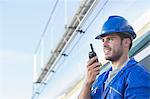 Worker using walkie-talkie