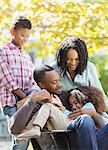 Happy family hugging outdoors