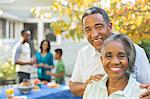 Portrait of smiling senior couple at barbecue