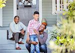 Multi-generation men on porch steps