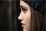 Close-up portrait of teenage girl outdoors wearing hat, Germany