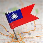 Small Flag of Taiwan or Republic of China on a Map Background with Selective Focus.