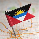 Small Flag of Antigua and Barbuda on a Map Background with Selective Focus.