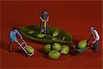 Miniature Construction Workers in Conceptual Food Imagery With Snap Peas