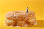 Miniature Police Officers in Conceptual Food Imagery With Donuts