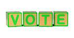 Vote on Colored Wooden Childrens Alphabet Block Isolated on White.