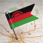 Small Flag Malawi on a Map Background with Selective Focus.