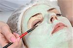 beauty salon, facial mask around eyes applying using brush