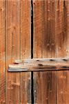 Old wooden weathered barn or shed door