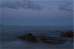 Twilight view of rocky coast (Crystal Crescent Beach, Nova Scotia, Canada)