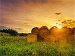 Hay bales at sunset