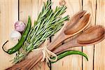 Herbs, spices and utensil on wooden table background