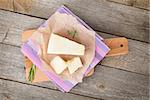 Parmesan cheese on wooden table background