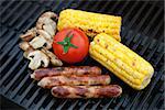 Grill bbq party with sausages, mushrooms and vegetables