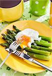 Poached egg and green asparagus for breakfast