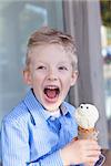 excited little boy eating ice-cream