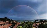 Rainbow over lake of Varese, panorama from Biandronno - Lombardy, Italy
