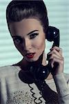 close-up shoot of charming elegant lady talking on vintage phone with receiver