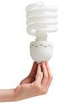 Hand holding energy efficient light bulb on white background