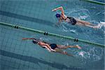 Female swimmers racing in the swimming pool at the leisure center