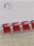 Digital Illustration of Overhead View of Four Red Chairs in a Row in front of Concrete Wall