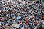 Pile of waste packaging, plastic bottles and tin cans