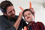 Father and son with carrot horns