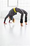 Young woman in yoga position