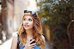 Young woman exploring quaint street, Rome, Italy