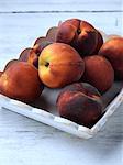 A bowl of ripe peaches