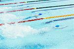 Swimmers racing in pool