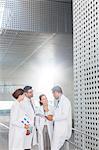 Doctors talking in hospital corridor