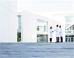 Doctors talking on rooftop