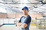 Portrait of confident worker in food processing plant